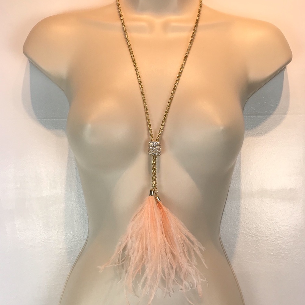 Long gold rope necklace rhinestone accent feathers